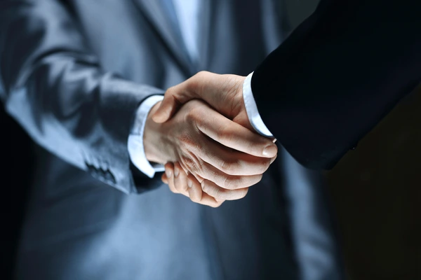 handshake-hand-holding-on-black-600nw-132708305